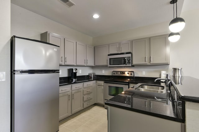 2312 Branson Landing Blvd Unit A, Branson, MO 65616 - kitchen with appliances with stainless steel finishes, gray cabinetry, a sink, dark stone countertops, and recessed lighting