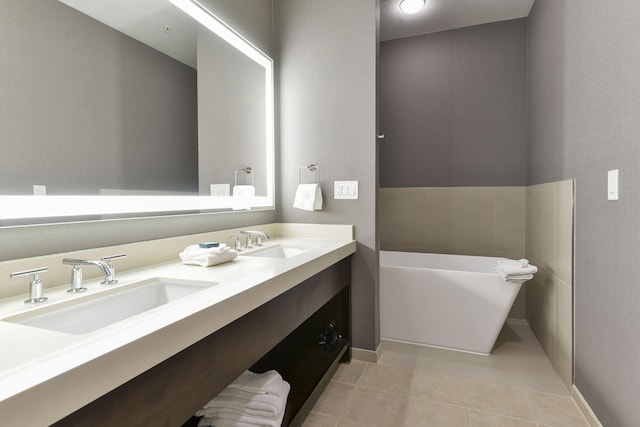 2312 Branson Landing Blvd Unit A, Branson, MO 65616 - bathroom with a soaking tub, tile patterned flooring, and double vanity