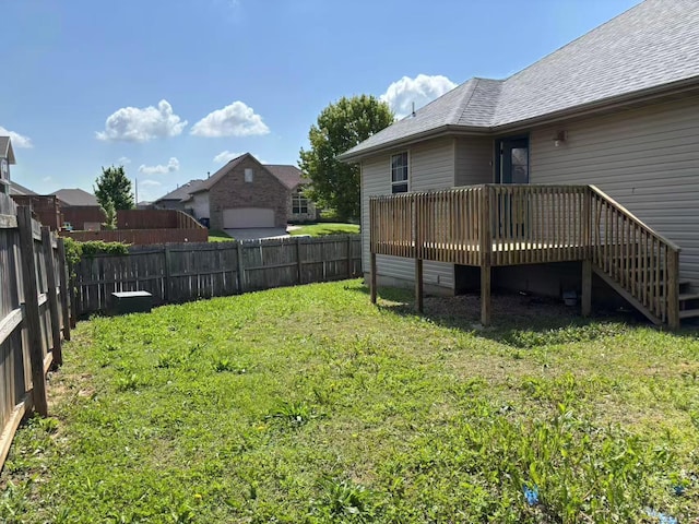 view of yard featuring a wooden deck