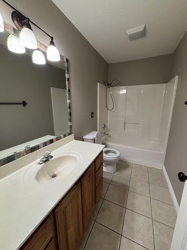 full bath featuring toilet, tile patterned flooring, vanity, and bathing tub / shower combination