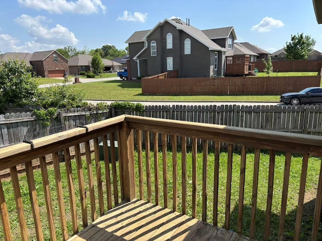 wooden terrace featuring a residential view