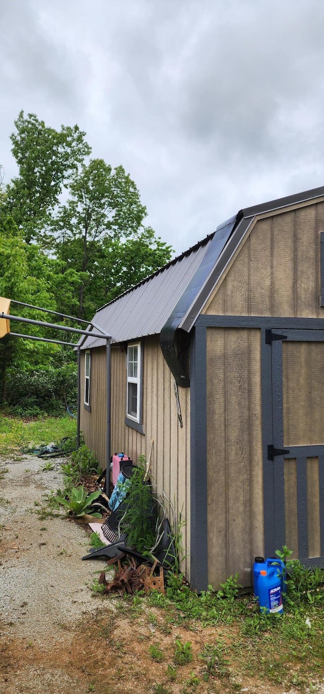19879 Farm Rd Unit 1043, Exeter, MO 65647 - view of home's exterior featuring a storage unit, an outbuilding, and metal roof