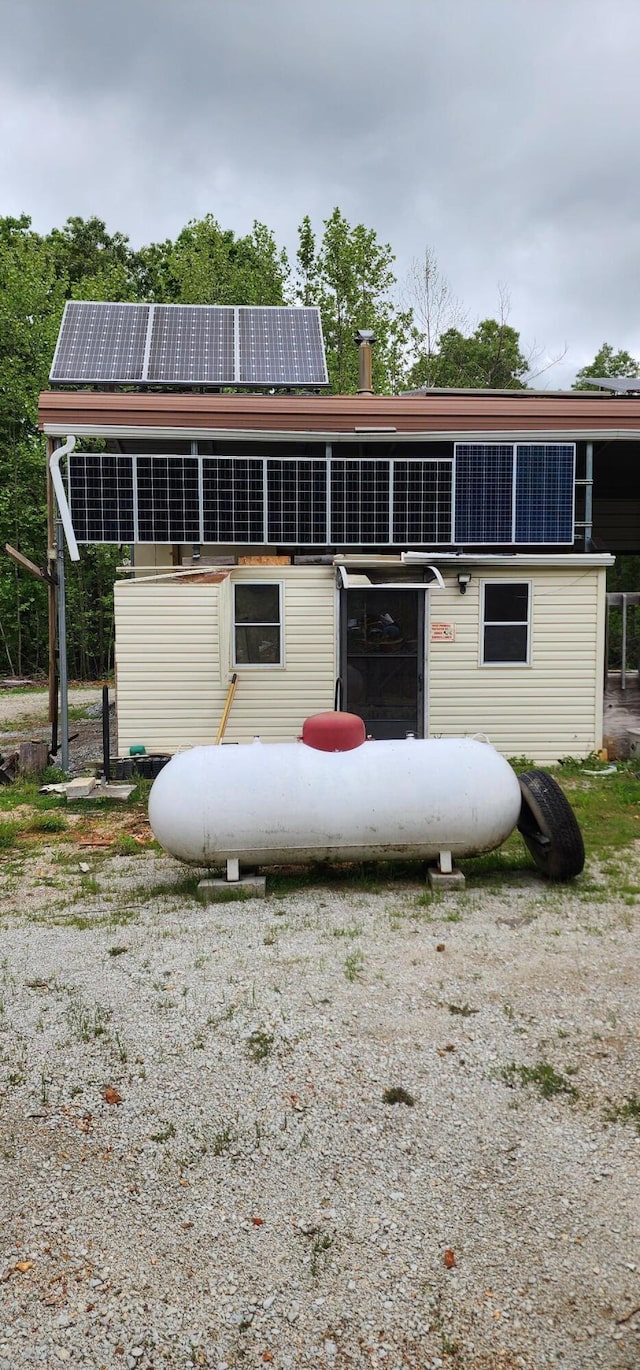 19879 Farm Rd Unit 1043, Exeter, MO 65647 - view of front facade featuring roof mounted solar panels