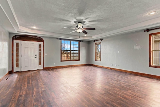 1602 E Fairwind, Ozark, MO 65721 - unfurnished room with wood finished floors, ceiling fan, a tray ceiling, a textured ceiling, and baseboards