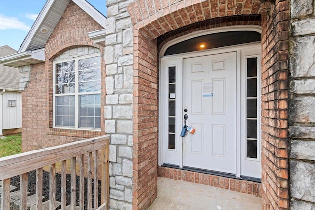 1602 E Fairwind, Ozark, MO 65721 - doorway to property with brick siding and stone siding