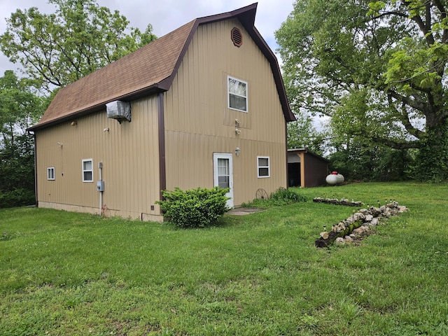 1100 County Road 8270, West Plains, MO 65775 - view of home's exterior with a gambrel roof, a shingled roof, and a yard