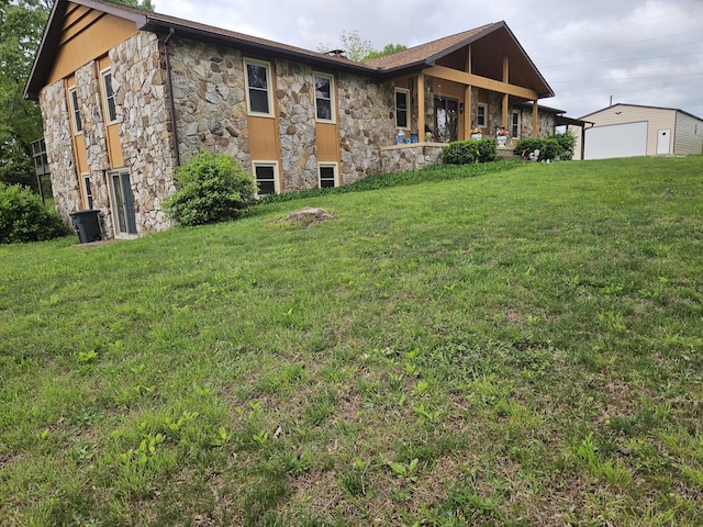 1100 County Road 8270, West Plains, MO 65775 - rear view of house featuring stone siding, a yard, and a detached garage