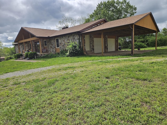 1100 County Road 8270, West Plains, MO 65775 - back of property featuring an attached garage, a lawn, a chimney, and stone siding