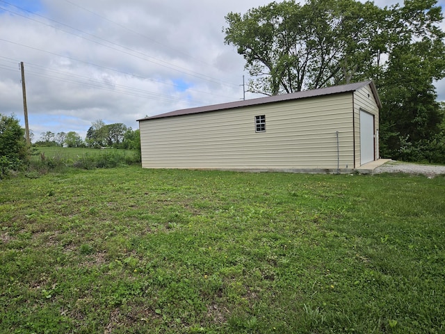 1100 County Road 8270, West Plains, MO 65775 - view of grassy yard featuring an outdoor structure and a garage