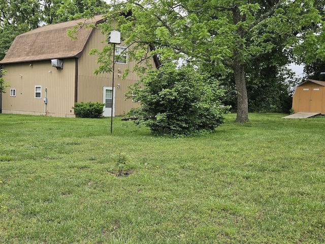 1100 County Road 8270, West Plains, MO 65775 - view of grassy yard featuring an outbuilding and a storage shed