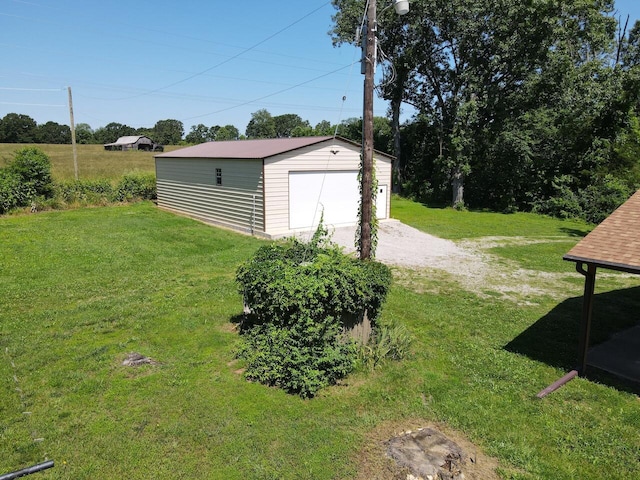 1100 County Road 8270, West Plains, MO 65775 - view of green lawn featuring an outdoor structure and a garage