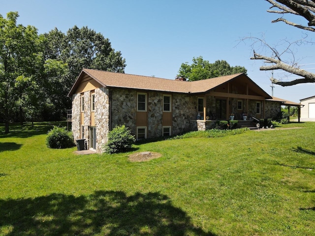 1100 County Road 8270, West Plains, MO 65775 - rear view of property featuring stone siding, a yard, and covered porch