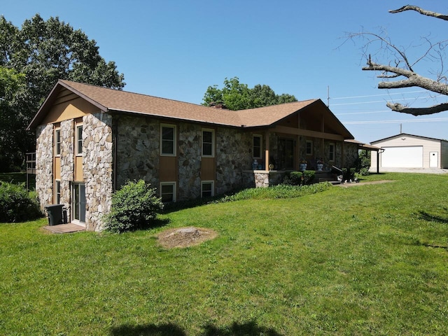 1100 County Road 8270, West Plains, MO 65775 - view of property exterior with stone siding, a yard, an outbuilding, and a garage