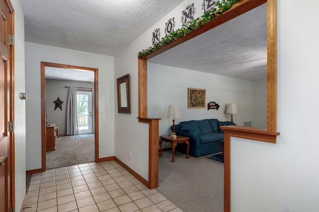 13860 Lawrence Unit 1158, Mount Vernon, MO 65712 - corridor with light carpet, a textured ceiling, baseboards, and light tile patterned flooring