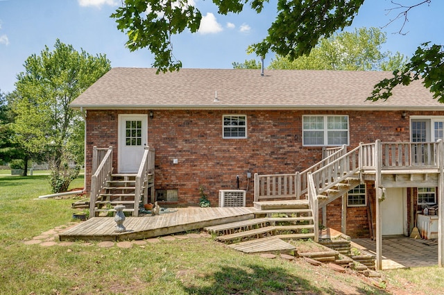 13860 Lawrence Unit 1158, Mount Vernon, MO 65712 - rear view of property with a deck, brick siding, a lawn, and entry steps