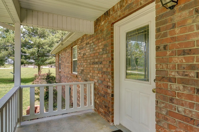 13860 Lawrence Unit 1158, Mount Vernon, MO 65712 - view of exterior entry with brick siding and covered porch