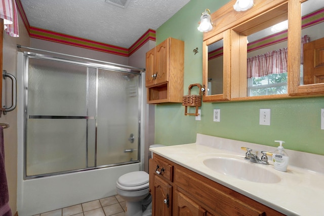 13860 Lawrence Unit 1158, Mount Vernon, MO 65712 - full bath featuring toilet, vanity, bath / shower combo with glass door, tile patterned flooring, and a textured ceiling