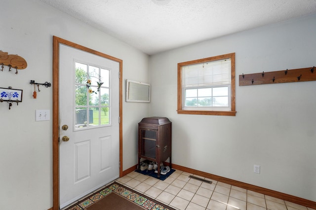 13860 Lawrence Unit 1158, Mount Vernon, MO 65712 - doorway to outside with healthy amount of natural light, baseboards, and a textured ceiling