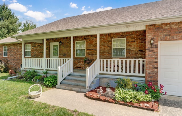 13860 Lawrence Unit 1158, Mount Vernon, MO 65712 - entrance to property with a porch, roof with shingles, brick siding, and a garage