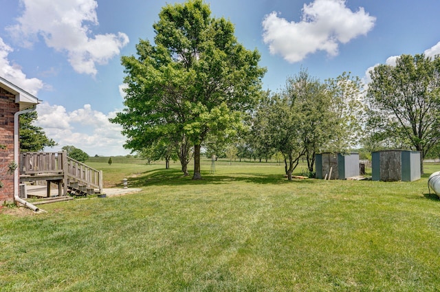 13860 Lawrence Unit 1158, Mount Vernon, MO 65712 - view of grassy yard with a shed, an outdoor structure, and stairs