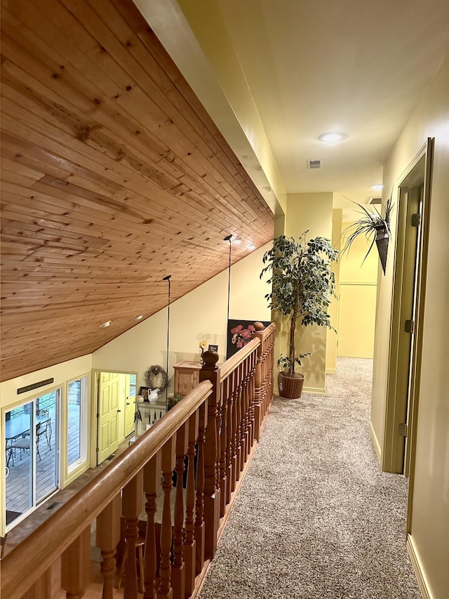 136 Riverview Dr, Mammoth Spring, AR 72554 - corridor featuring carpet flooring, an upstairs landing, vaulted ceiling, wooden ceiling, and baseboards