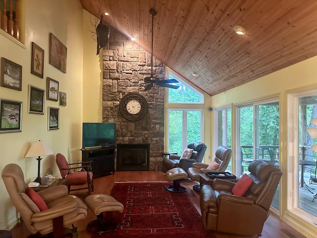 136 Riverview Dr, Mammoth Spring, AR 72554 - living room with wood finished floors, wooden ceiling, high vaulted ceiling, a stone fireplace, and ceiling fan