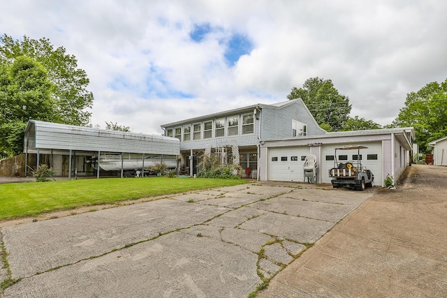view of front facade featuring a front lawn and an attached garage