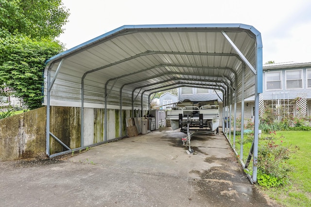 view of vehicle parking with a carport and driveway