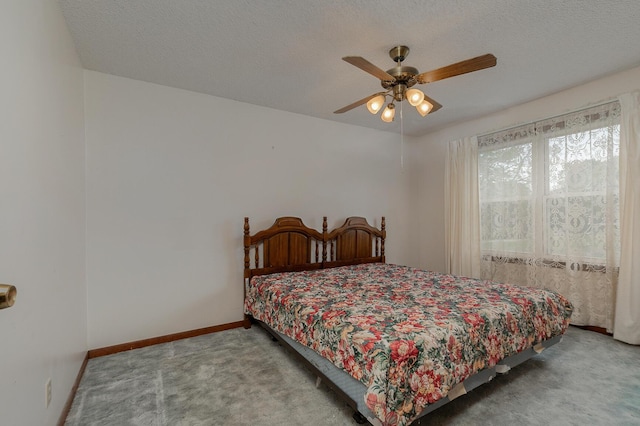 bedroom with carpet floors, baseboards, a textured ceiling, and ceiling fan