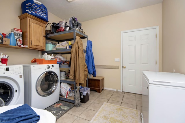 904 W Crater Cir, Nixa, MO 65714 - clothes washing area featuring independent washer and dryer, cabinet space, and light tile patterned flooring