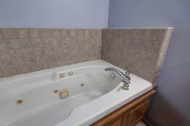904 W Crater Cir, Nixa, MO 65714 - full bathroom featuring a tub with jets and a textured wall