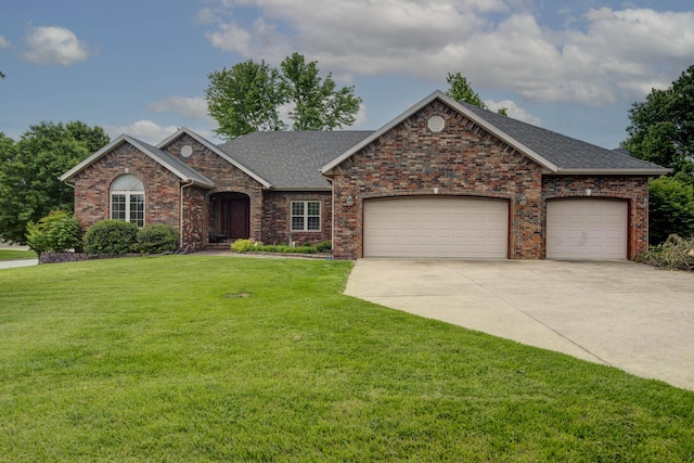 904 W Crater Cir, Nixa, MO 65714 - view of front of house featuring concrete driveway, an attached garage, a front lawn, and a shingled roof