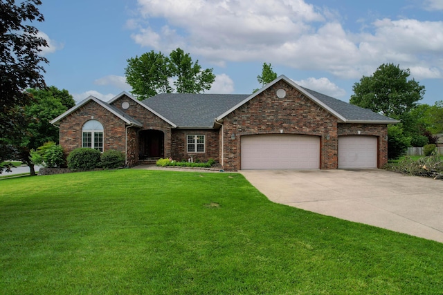 904 W Crater Cir, Nixa, MO 65714 - view of front of home featuring concrete driveway, a front lawn, an attached garage, roof with shingles, and brick siding