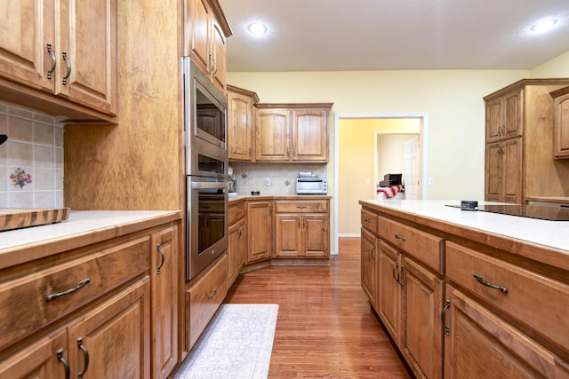 904 W Crater Cir, Nixa, MO 65714 - kitchen featuring stainless steel appliances, light countertops, dark wood finished floors, and recessed lighting