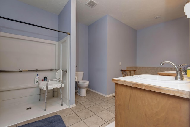 904 W Crater Cir, Nixa, MO 65714 - bathroom with a sink, tile patterned floors, toilet, tasteful backsplash, and baseboards