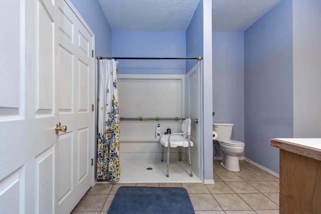 904 W Crater Cir, Nixa, MO 65714 - bathroom with toilet, tile patterned floors, and a shower with shower curtain