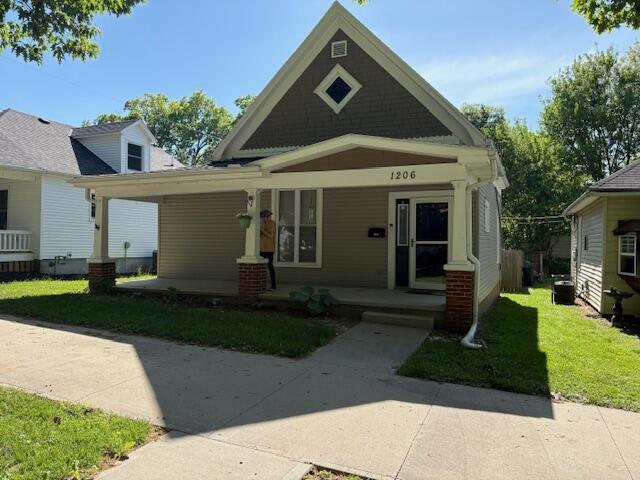 view of front facade with a porch and a front yard