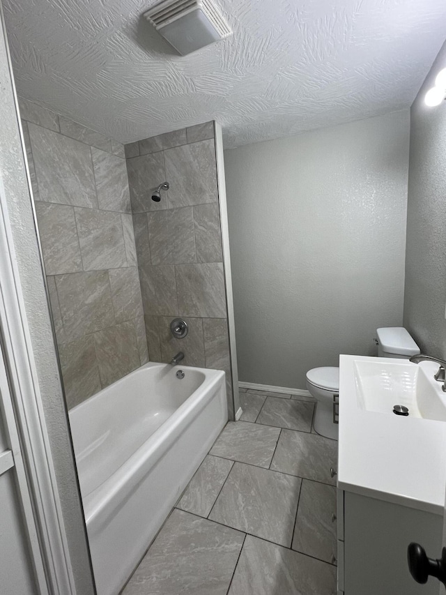 full bath with toilet, vanity, and washtub / shower combination