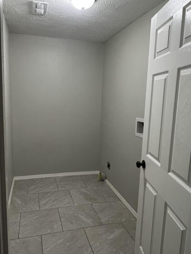 laundry room with hookup for an electric dryer, baseboards, and hookup for a washing machine