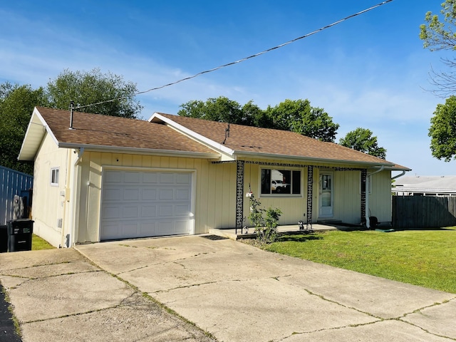 view of front of home with concrete driveway and a garage