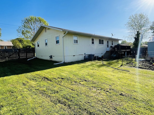 rear view of property featuring crawl space, stairway, a deck, and central AC