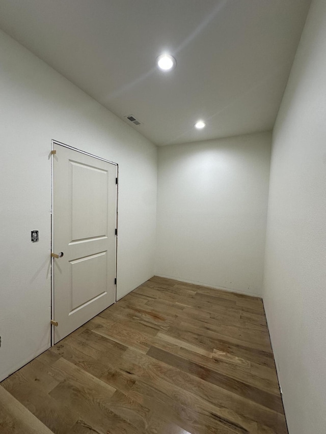 unfurnished room featuring wood finished floors and recessed lighting