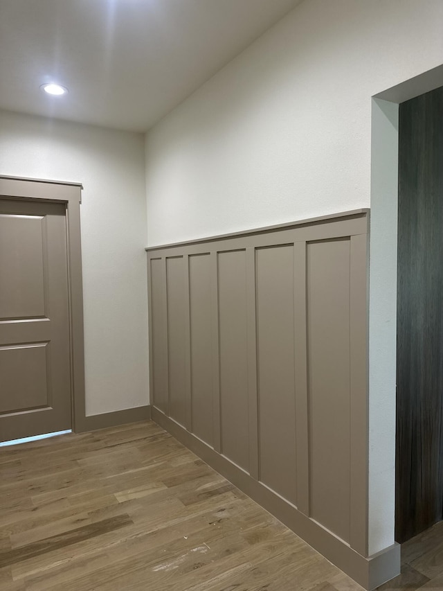 1988 Morris Rd, Mountain Grove, MO 65711 - hallway featuring wood finished floors, a decorative wall, and recessed lighting
