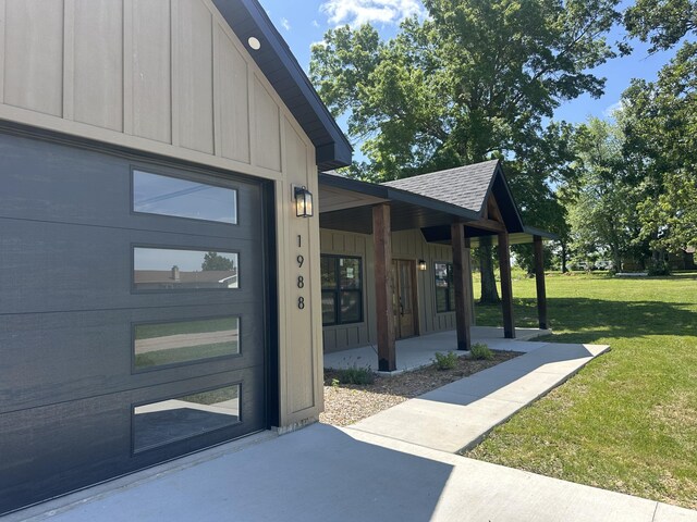1988 Morris Rd, Mountain Grove, MO 65711 - entrance to property featuring a lawn, a porch, roof with shingles, and board and batten siding