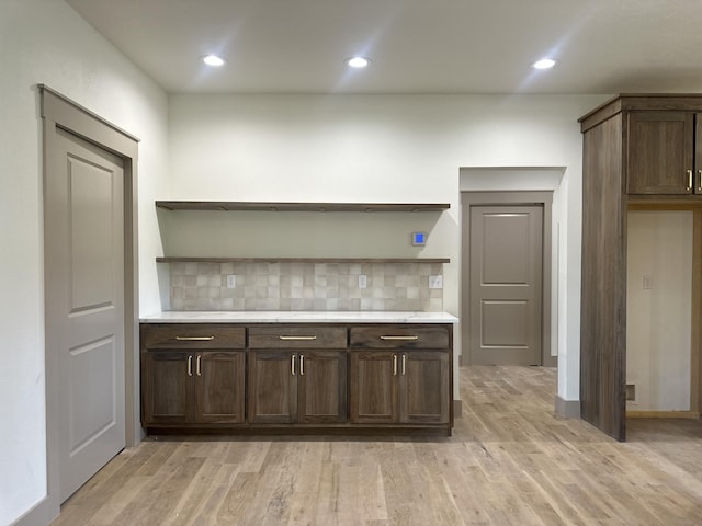 1988 Morris Rd, Mountain Grove, MO 65711 - kitchen with open shelves, decorative backsplash, dark brown cabinetry, light wood-style floors, and recessed lighting
