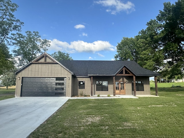 1988 Morris Rd, Mountain Grove, MO 65711 - modern farmhouse style home with an attached garage, a front yard, concrete driveway, french doors, and a shingled roof