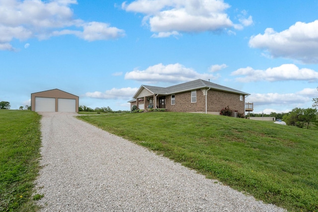 5376 S 140th Rd, Morrisville, MO 65710 - single story home featuring brick siding, an outdoor structure, a garage, and a front yard