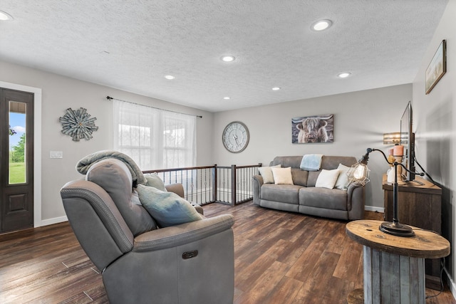 5376 S 140th Rd, Morrisville, MO 65710 - living room with dark wood-style floors, baseboards, recessed lighting, and a textured ceiling