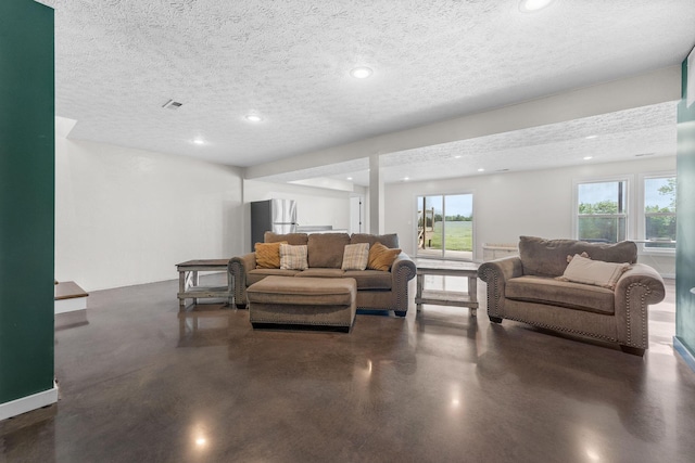 5376 S 140th Rd, Morrisville, MO 65710 - living area featuring finished concrete flooring, a textured ceiling, and recessed lighting