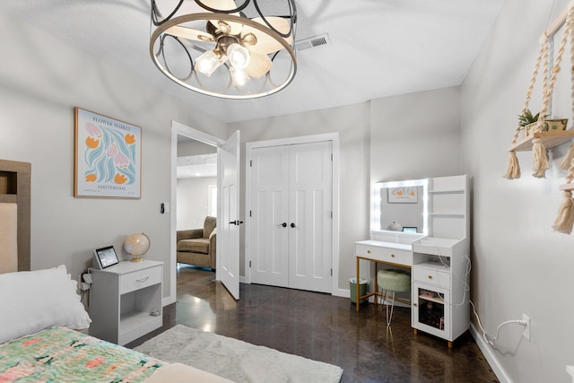 5376 S 140th Rd, Morrisville, MO 65710 - bedroom with concrete floors, baseboards, a closet, and a chandelier